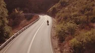 Aerial Shot Extreme Motorcyclist Riding Sport Bike Motorcycle On Curvy Road Film Stock Footage