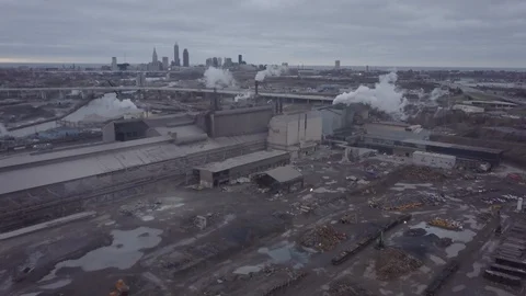 Aerial Shot Of Factory Pumping Smoke In Cleveland, OH Stock Footage