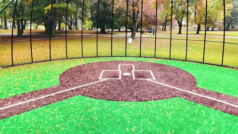 Aerial Shot of Fall Foilage. Flying into Baseball Field Home Plate Stock Footage 254435230