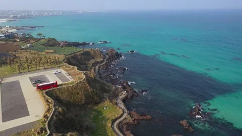 Aerial shot of fields, beach and seaside village,Jeju Island,South Korea Stock Footage 245953538