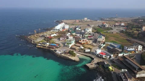Aerial shot of fields, beach and seaside village,Jeju Island,South Korea Stock Footage 245953572