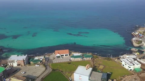 Aerial shot of fields, beach and seaside village,Jeju Island,South Korea Stock Footage 245953612