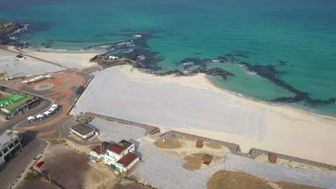 Aerial shot of fields, beach and seaside village,Jeju Island,South Korea Stock Footage 245953673