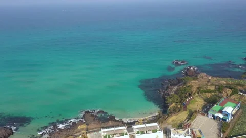 Aerial shot of fields, beach and seaside village,Jeju Island,South Korea Stock Footage 245953676