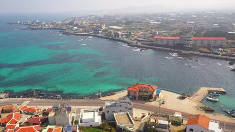 Aerial shot of fields, beach and seaside village,Jeju Island,South Korea Stock Footage 245953740