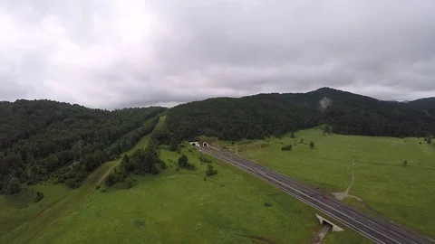 Aerial shot, Fields, Sky, Greenery, Drone, Highway, Cars, Mountains, HD Stock Footage 82529694