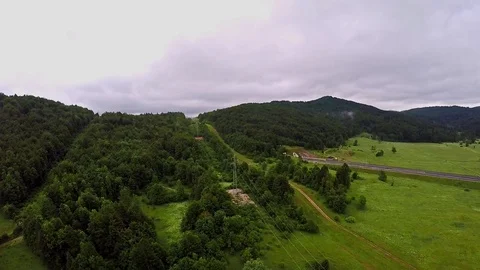 Aerial shot, Fields, Sky, Greenery, Drone, Highway, Road, Cars, Mountains, HD Stock Footage 82537587