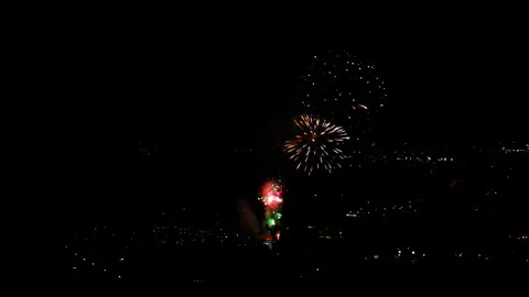 Aerial Shot Of Fireworks Exploding Against Sky At Night, Drone Flying Forward Stock Footage 243883361