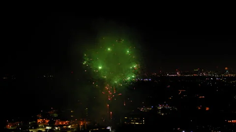 Aerial Shot Of Fireworks Exploding In Neighborhood At Night, Drone Flying Over Stock Footage 243880358