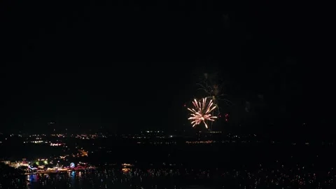 Aerial shot of fireworks exploding in the sky for the 4th of July in Okoboji Stock Footage 312786741