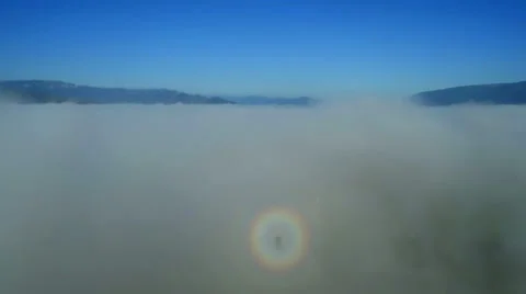 Aerial shot: Flight in fog over fields and mountains. Morning Fog and the Sun. Stock Footage 34284875