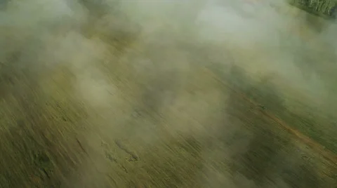 Aerial shot: Flight in fog over fields and mountains. Morning Fog and the Sun. Stock Footage 34285167