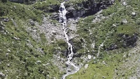 Aerial shot flight over an alpine stream towards a waterfall HD Stock Footage 159092870