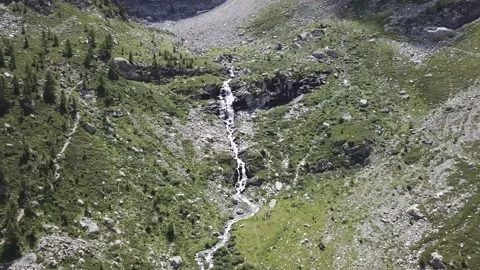 Aerial shot flight over an alpine stream towards a waterfall1 Stock Footage 159093006