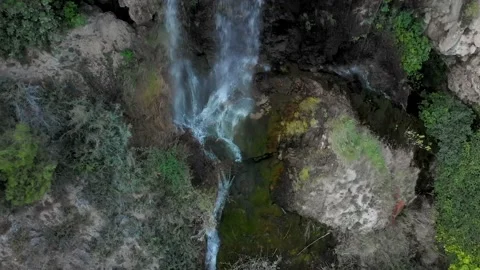 Aerial Shot Fliying Over a Tiny Cascade Stock Footage 139089443