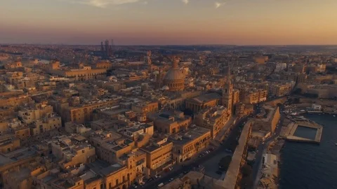 Aerial shot flying backwards at Sunset in Malta Stock Footage 90682424