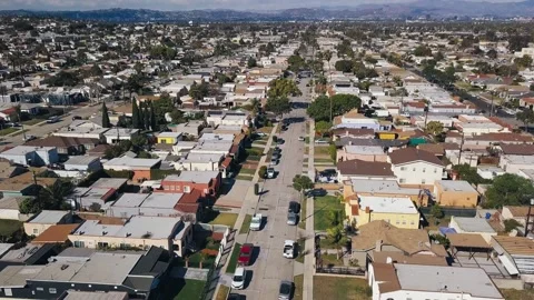 Aerial shot flying down overlooking South LA with blue sky clouds on the horizon Vidéo 145296296