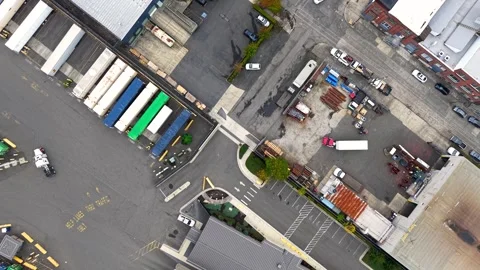 Aerial shot flying forward over a large industrial park with warehouses, di.. Stock Footage 329660423