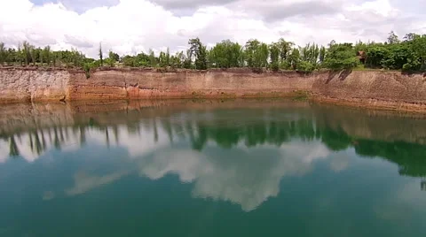 Aerial Shot: Flying Over Cliffs in Water Canyon Backwards Stock Footage 55296523