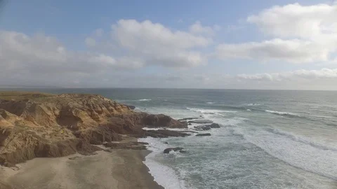 Aerial shot, flying over cliffs at beach and back out to sea 001205 DJI_0002.mp4 Stock Footage 90563702