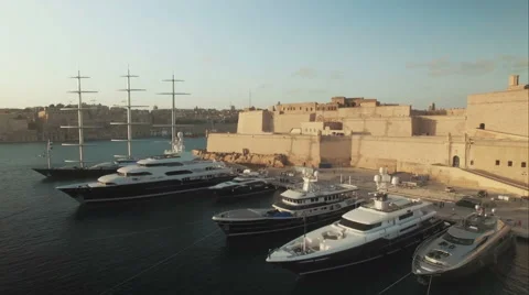 Aerial Shot - Flying over a Fort and luxury Yachts Stock Footage 61241663