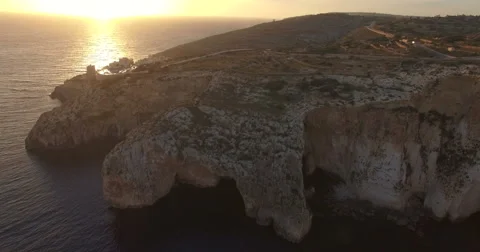 Aerial shot - Flying Sideways over Cliffs during Sunset Stock Footage 61380879