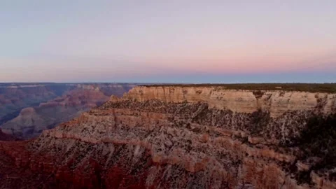 Aerial shot flying through red rock wall to reveal more layered rock formations Video stock 336577108