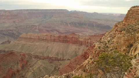Aerial shot flying through red rock wall to reveal more layered rock formations Stock Footage 336578057