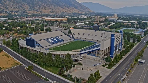 Aerial Shot of Football Stadium with Mountain Backdrop Stock Footage