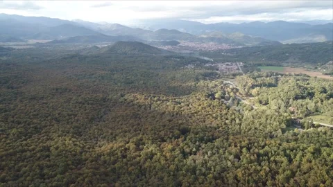 Aerial shot of a forest in fall. The Pyrenees in the back. Garrotxa, Catalonia. Stock Footage 140364989