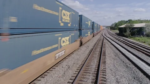 Aerial shot of freight train passing quickly through American town 3 (4K) Stock Footage 127763795
