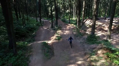 Aerial shot front view MTB BMX Trick- table top dirt jump Stock Footage 67504536