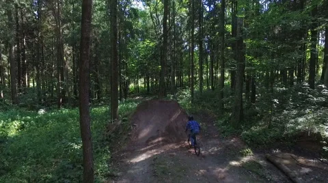Aerial shot front view MTB BMX Trick- table top dirt jump Stock Footage 67504743
