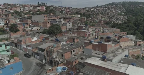 Aerial shot getting close to small houses in a poor community Stock Footage 140626625