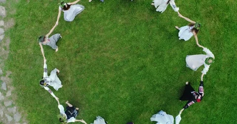 Aerial shot: Girls dancing in a circle at the festival of Ivan Kupala Stock Footage