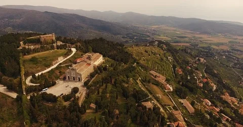 Aerial shot, a gorgeous town Cortona among the hills in Tuscany, Italy, Stock Footage
