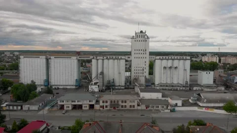 Aerial shot of Grain storage, for drying grain elevator, old building in small Stock Footage 132131396