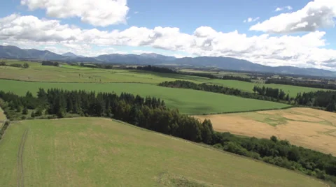 Aerial shot of green fields and mountain Stock Footage 34252595