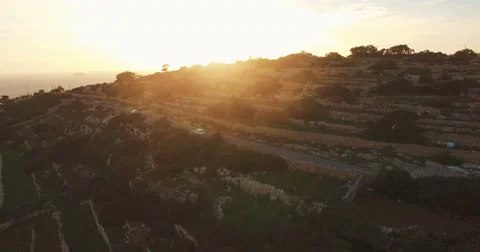 Aerial shot - Green Fields during Sunset Stock Footage 61380538