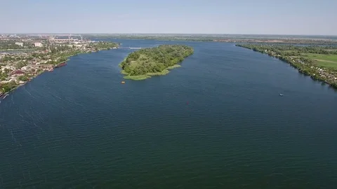 Aerial shot of a green island on the Dnipro river in a sunny day in summer Stock Footage