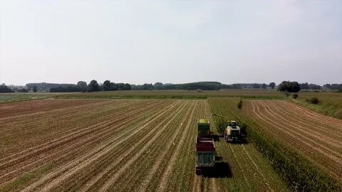 Aerial shot of harvester loading off corn Stock Footage 137179219