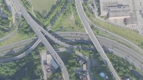 Aerial shot highway exit camera pointing down rotating during sunny day Stock Footage 61112125