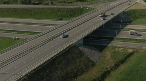 Aerial Shot of Highway with Intersections in Rural Area in Bright Sunny Day Stock Footage 64679697