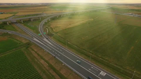 Aerial Shot of Highway with Intersections in Rural Area in Bright Sunny Day Stock Footage 64768930