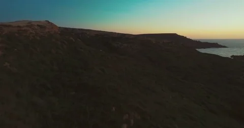 Aerial shot of a hill in the dark Stock Footage 74055134