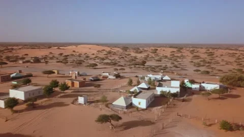Aerial shot, horizontal view of a small town in Sahara Desert in West Africa Stock Footage 155720795
