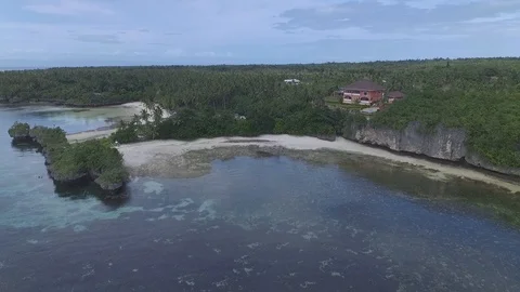 Aerial shot of house on the cliffs with view on the beach and ocean Stock Footage 94536033