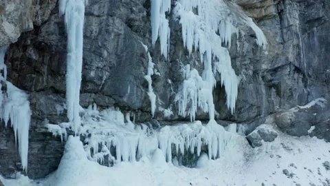 Aerial shot of a huge icefall on a cliff to climb during winter, in Switzerland Stock Footage 239590803