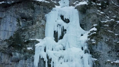 Aerial shot of a huge icefall on a cliff to climb during winter, in Switzerland Stock Footage 239593010