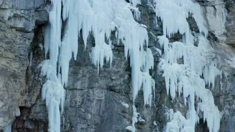 Aerial shot of a huge icefall on a cliff to climb during winter, in Switzerland Stock Footage 239594859